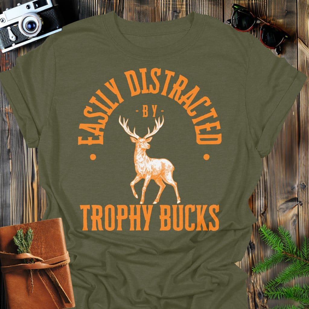Distracted by Trophy Bucks T-Shirt In S / Military Green Lightweight adventure tee for outdoor lovers Perfect for hiking camping or road trips Made from soft breathable cotton for all-day comfort Ideal for nature lovers and adventurers FAYO Threads outdoor apparel remember Fun Awaits You Outside