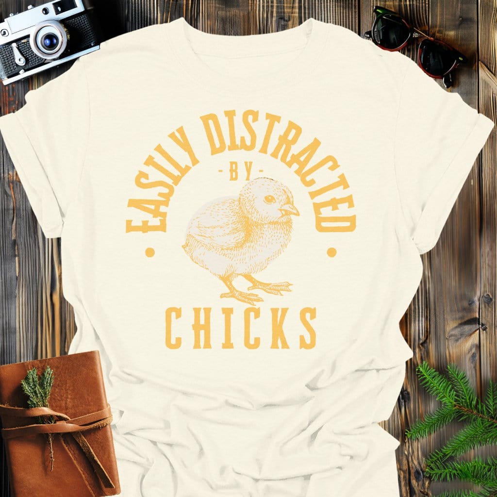 Distracted by Chicks T-Shirt In S / Natural Lightweight adventure tee for outdoor lovers Perfect for hiking camping or road trips Made from soft breathable cotton for all-day comfort Ideal for nature lovers and adventurers FAYO Threads outdoor apparel remember Fun Awaits You Outside