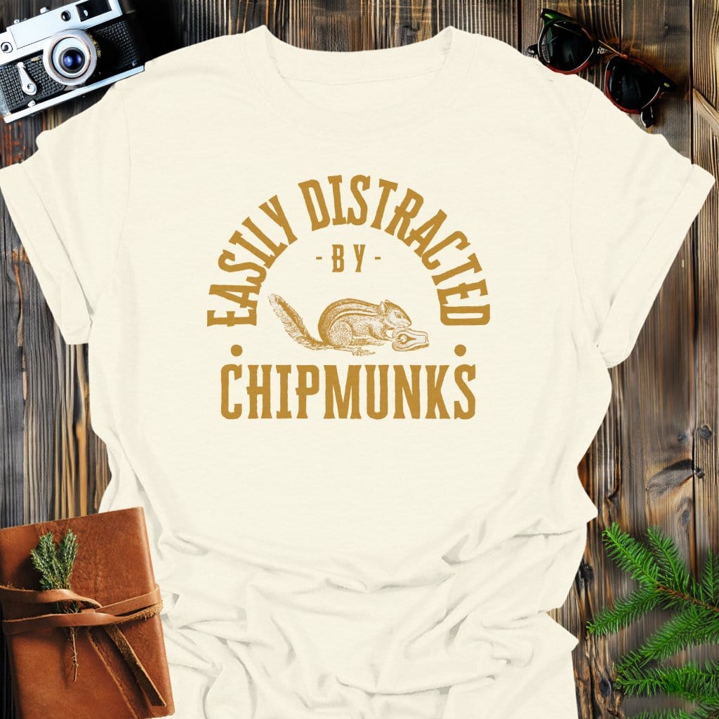 Distracted by Chipmunks T-Shirt In S / Natural Lightweight adventure tee for outdoor lovers Perfect for hiking camping or road trips Made from soft breathable cotton for all-day comfort Ideal for nature lovers and adventurers FAYO Threads outdoor apparel remember Fun Awaits You Outside