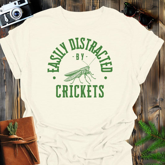 Distracted By Crickets T-Shirt In S / Natural Lightweight adventure tee for outdoor lovers Perfect for hiking camping or road trips Made from soft breathable cotton for all-day comfort Ideal for nature lovers and adventurers FAYO Threads outdoor apparel remember Fun Awaits You Outside