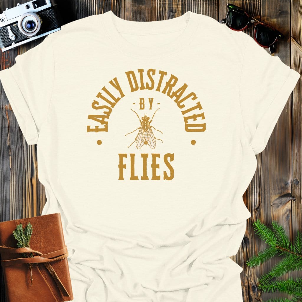 Distracted By Flies T-Shirt In S / Natural Lightweight adventure tee for outdoor lovers Perfect for hiking camping or road trips Made from soft breathable cotton for all-day comfort Ideal for nature lovers and adventurers FAYO Threads outdoor apparel remember Fun Awaits You Outside