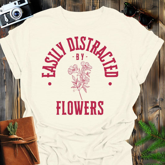 Distracted by Flowers T-Shirt In S / Natural Lightweight adventure tee for outdoor lovers Perfect for hiking camping or road trips Made from soft breathable cotton for all-day comfort Ideal for nature lovers and adventurers FAYO Threads outdoor apparel remember Fun Awaits You Outside