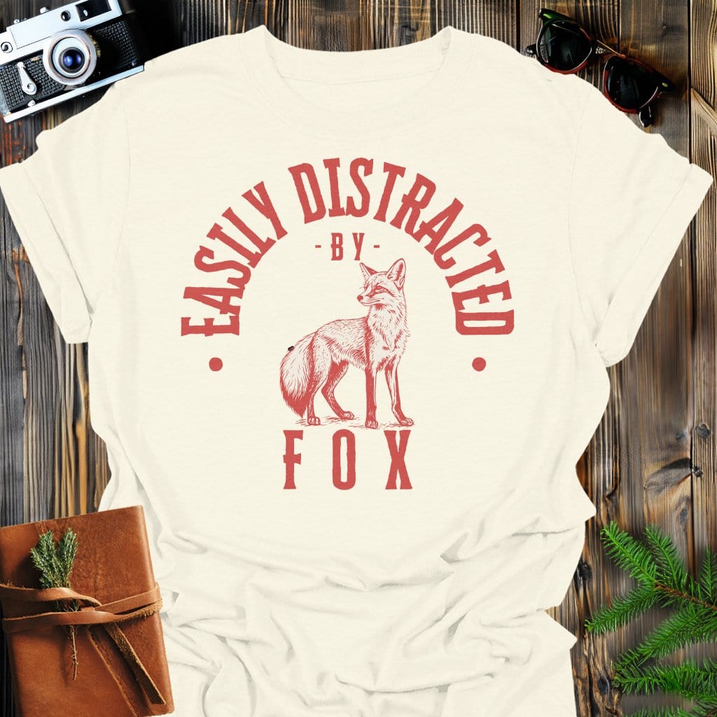 Distracted by Fox T-Shirt In S / Natural Lightweight adventure tee for outdoor lovers Perfect for hiking camping or road trips Made from soft breathable cotton for all-day comfort Ideal for nature lovers and adventurers FAYO Threads outdoor apparel remember Fun Awaits You Outside