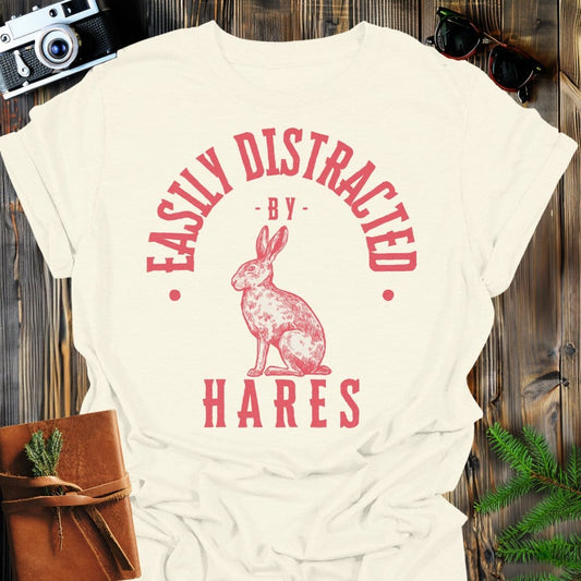 Distracted by Hares T-Shirt In S / Natural Lightweight adventure tee for outdoor lovers Perfect for hiking camping or road trips Made from soft breathable cotton for all-day comfort Ideal for nature lovers and adventurers FAYO Threads outdoor apparel remember Fun Awaits You Outside