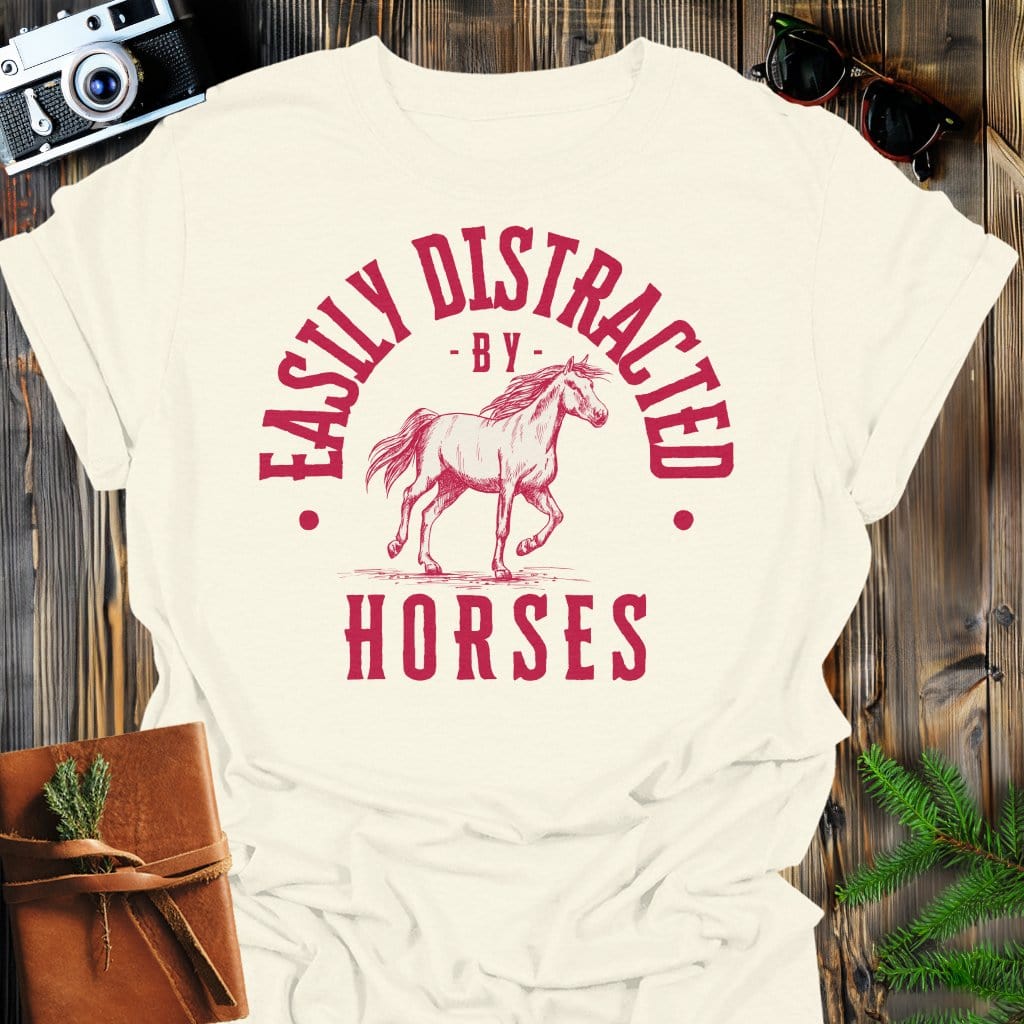 Distracted by Horses T-Shirt In S / Natural Lightweight adventure tee for outdoor lovers Perfect for hiking camping or road trips Made from soft breathable cotton for all-day comfort Ideal for nature lovers and adventurers FAYO Threads outdoor apparel remember Fun Awaits You Outside