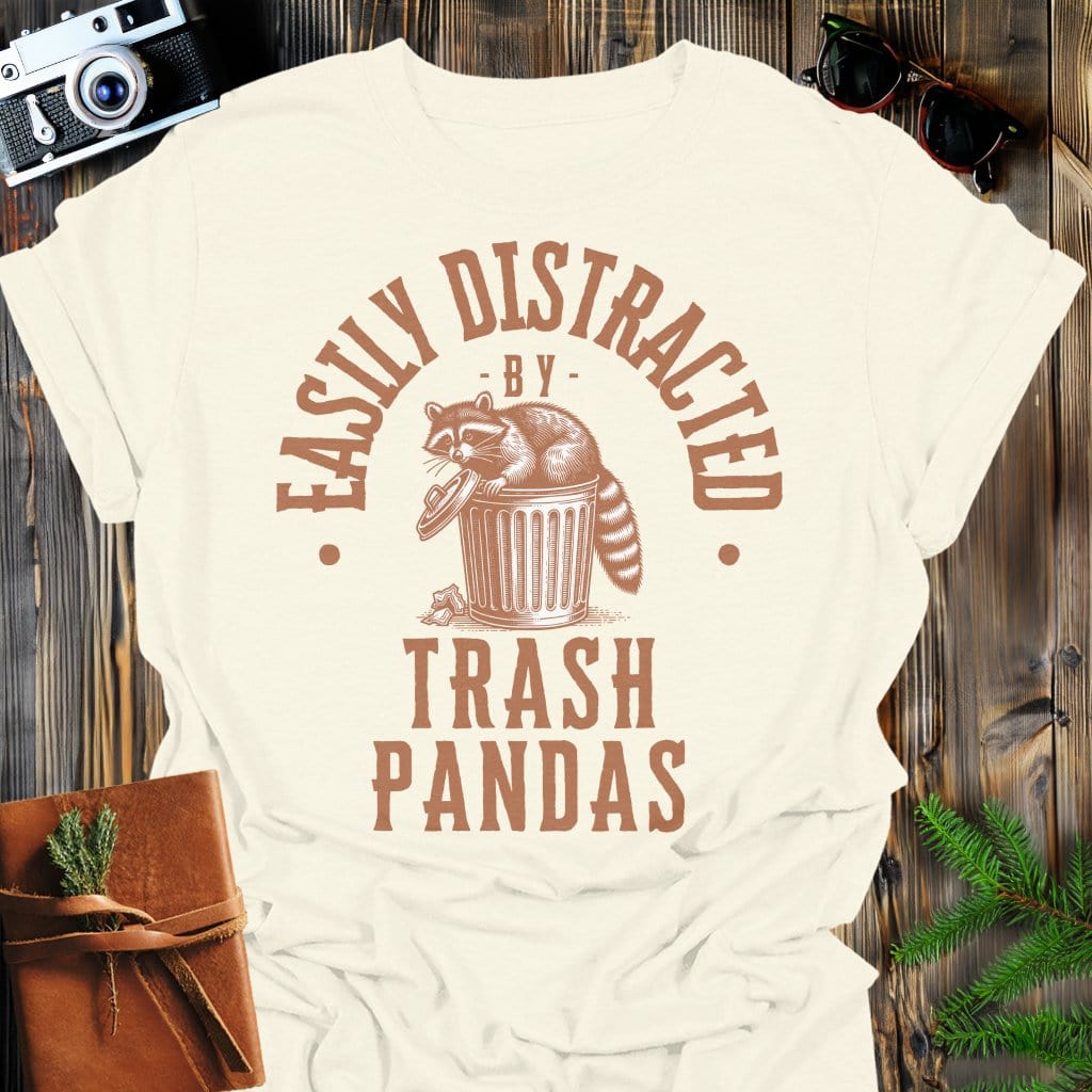 Distracted by Trash Pandas T-Shirt In S / Natural Lightweight adventure tee for outdoor lovers Perfect for hiking camping or road trips Made from soft breathable cotton for all-day comfort Ideal for nature lovers and adventurers FAYO Threads outdoor apparel remember Fun Awaits You Outside