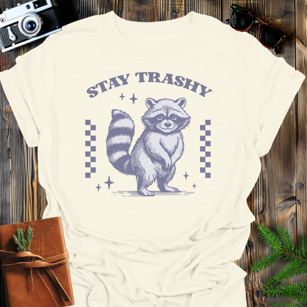 Stay Trashy Raccoon T-Shirt In Natural / S Lightweight adventure tee for outdoor lovers Perfect for hiking camping or road trips Made from soft breathable cotton for all-day comfort Ideal for nature lovers and adventurers FAYO Threads outdoor apparel remember Fun Awaits You Outside