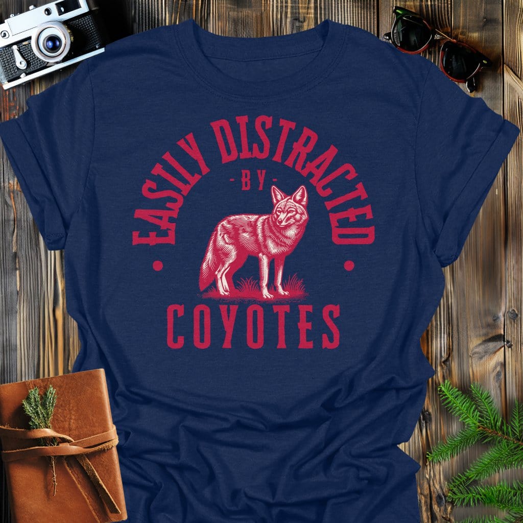 Distracted by Coyotes T-Shirt In S / Navy Lightweight adventure tee for outdoor lovers Perfect for hiking camping or road trips Made from soft breathable cotton for all-day comfort Ideal for nature lovers and adventurers FAYO Threads outdoor apparel remember Fun Awaits You Outside