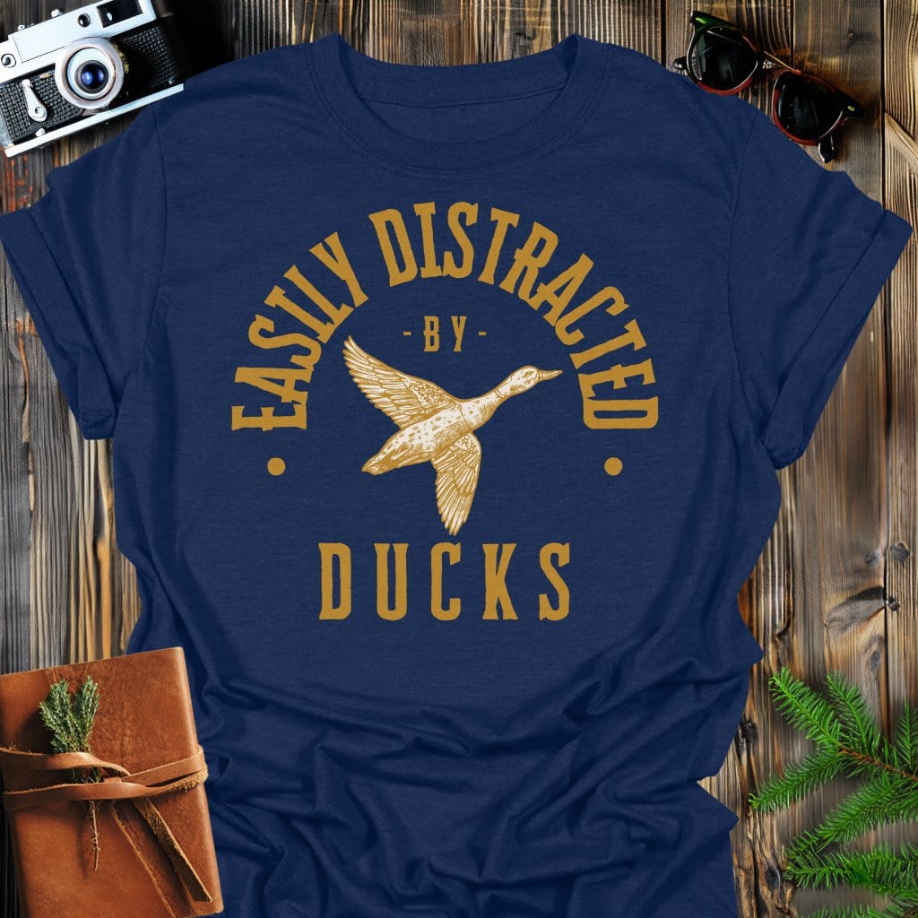 Distracted by Ducks T-Shirt In S / Navy Lightweight adventure tee for outdoor lovers Perfect for hiking camping or road trips Made from soft breathable cotton for all-day comfort Ideal for nature lovers and adventurers FAYO Threads outdoor apparel remember Fun Awaits You Outside