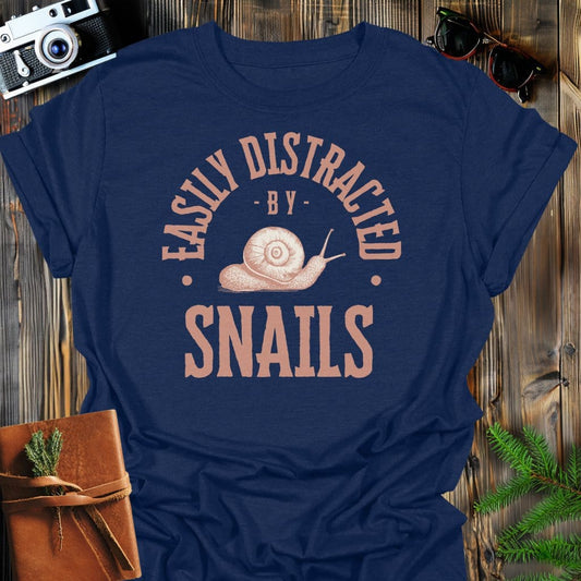 Distracted By Snails T-Shirt In S / Navy Lightweight adventure tee for outdoor lovers Perfect for hiking camping or road trips Made from soft breathable cotton for all-day comfort Ideal for nature lovers and adventurers FAYO Threads outdoor apparel remember Fun Awaits You Outside