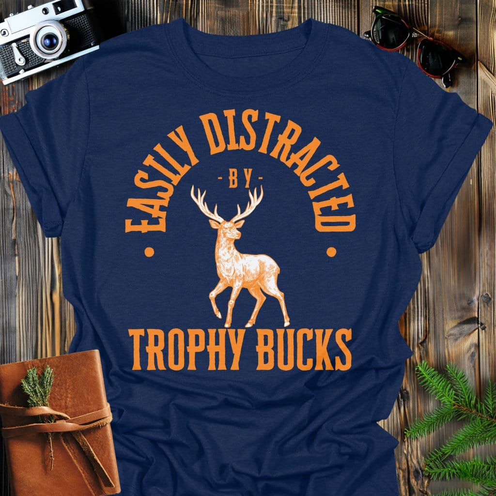 Distracted by Trophy Bucks T-Shirt In S / Navy Lightweight adventure tee for outdoor lovers Perfect for hiking camping or road trips Made from soft breathable cotton for all-day comfort Ideal for nature lovers and adventurers FAYO Threads outdoor apparel remember Fun Awaits You Outside