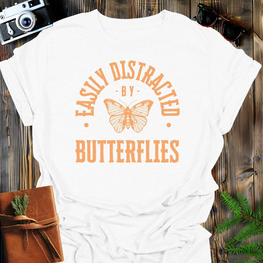 Distracted By Butterflies T-Shirt In S / White Lightweight adventure tee for outdoor lovers Perfect for hiking camping or road trips Made from soft breathable cotton for all-day comfort Ideal for nature lovers and adventurers FAYO Threads outdoor apparel remember Fun Awaits You Outside