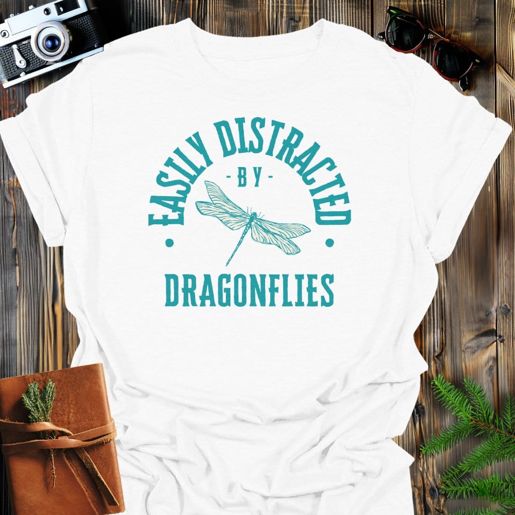 Distracted By Dragonflies T-Shirt In S / White Lightweight adventure tee for outdoor lovers Perfect for hiking camping or road trips Made from soft breathable cotton for all-day comfort Ideal for nature lovers and adventurers FAYO Threads outdoor apparel remember Fun Awaits You Outside
