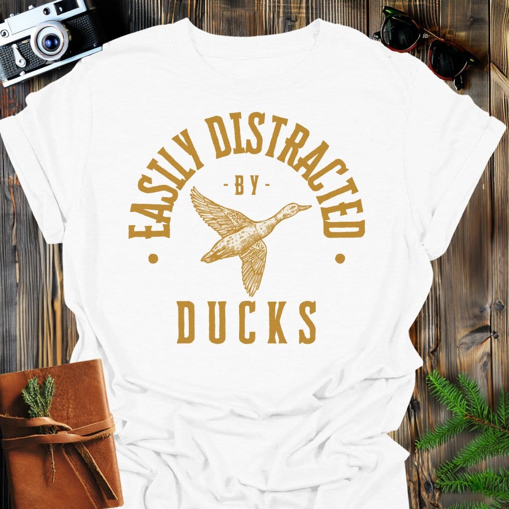 Distracted by Ducks T-Shirt In S / White Lightweight adventure tee for outdoor lovers Perfect for hiking camping or road trips Made from soft breathable cotton for all-day comfort Ideal for nature lovers and adventurers FAYO Threads outdoor apparel remember Fun Awaits You Outside