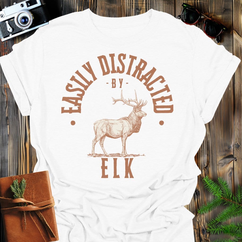 Distracted by Elk T-Shirt In S / White Lightweight adventure tee for outdoor lovers Perfect for hiking camping or road trips Made from soft breathable cotton for all-day comfort Ideal for nature lovers and adventurers FAYO Threads outdoor apparel remember Fun Awaits You Outside