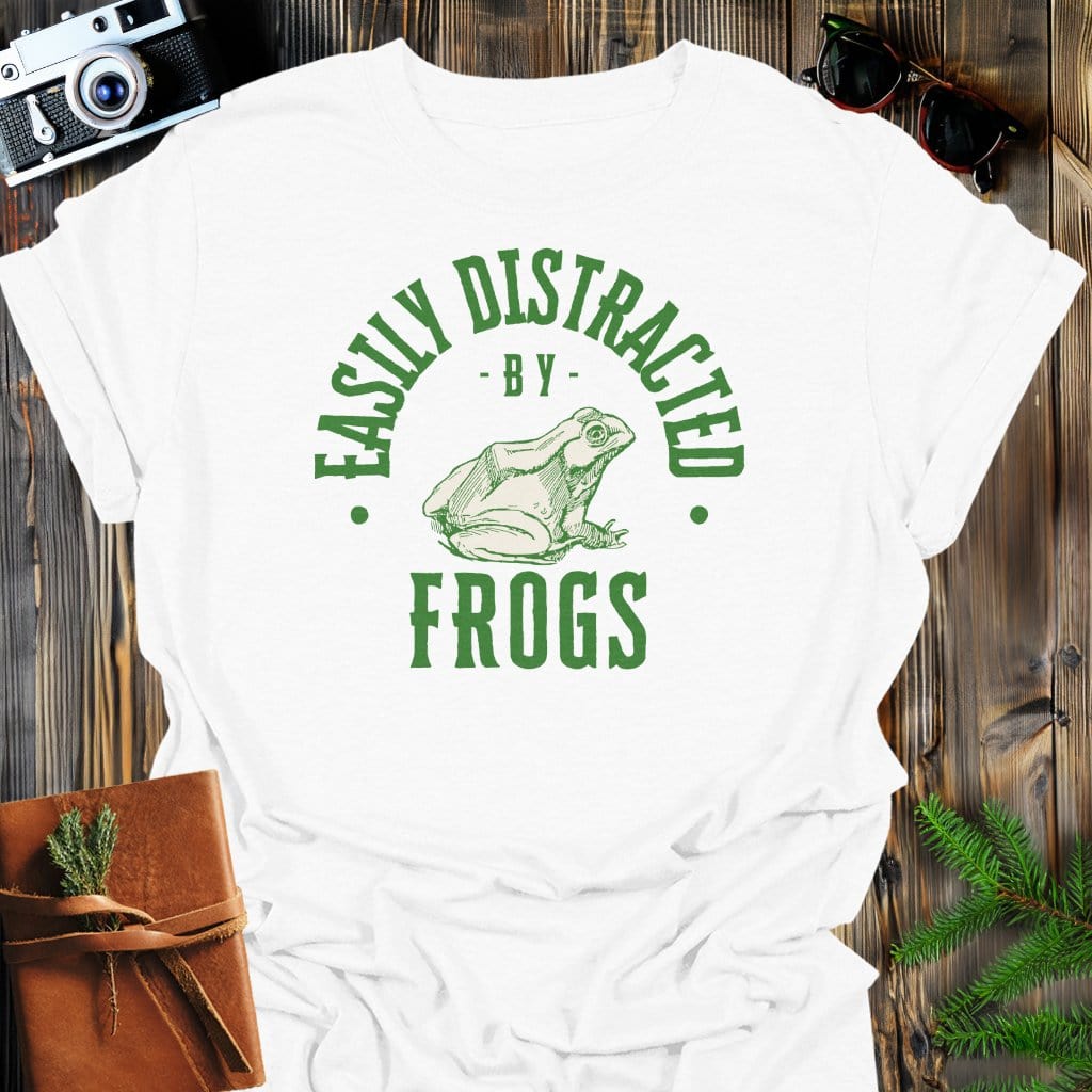 Distracted By Frogs T-Shirt In S / White Lightweight adventure tee for outdoor lovers Perfect for hiking camping or road trips Made from soft breathable cotton for all-day comfort Ideal for nature lovers and adventurers FAYO Threads outdoor apparel remember Fun Awaits You Outside