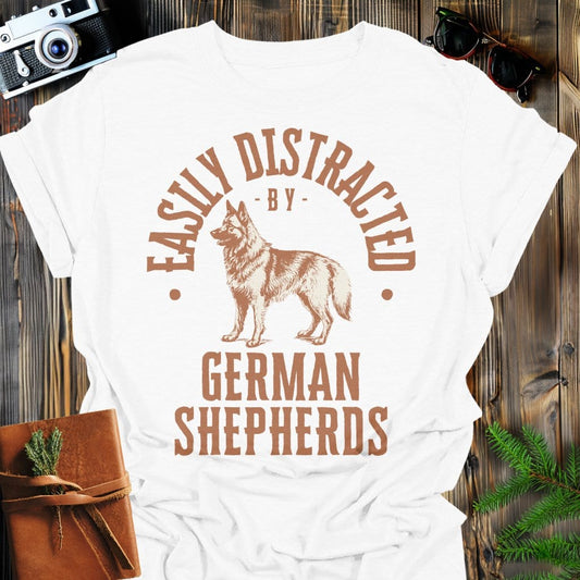 Distracted by German Shepherds T-Shirt In S / White Lightweight adventure tee for outdoor lovers Perfect for hiking camping or road trips Made from soft breathable cotton for all-day comfort Ideal for nature lovers and adventurers FAYO Threads outdoor apparel remember Fun Awaits You Outside
