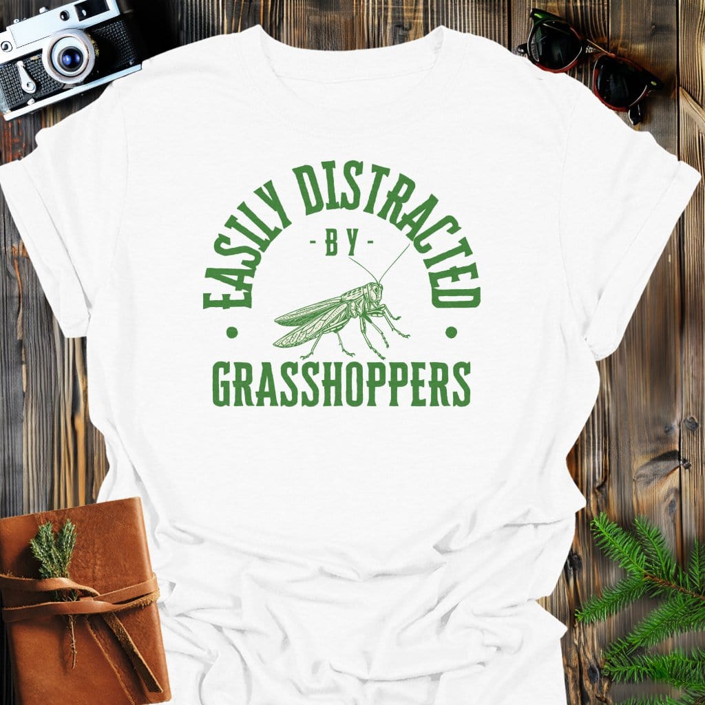 Distracted By Grasshoppers T-Shirt In S / White Lightweight adventure tee for outdoor lovers Perfect for hiking camping or road trips Made from soft breathable cotton for all-day comfort Ideal for nature lovers and adventurers FAYO Threads outdoor apparel remember Fun Awaits You Outside