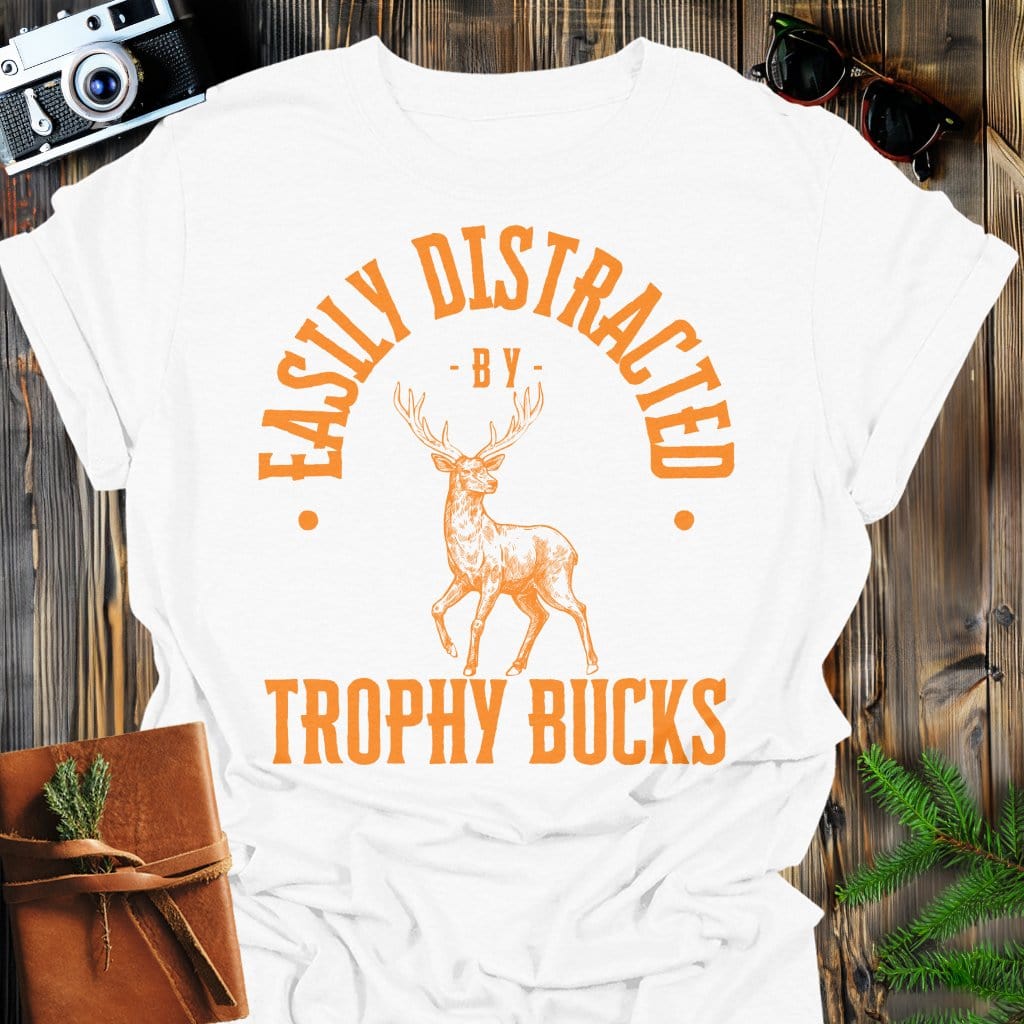 Distracted by Trophy Bucks T-Shirt In S / White Lightweight adventure tee for outdoor lovers Perfect for hiking camping or road trips Made from soft breathable cotton for all-day comfort Ideal for nature lovers and adventurers FAYO Threads outdoor apparel remember Fun Awaits You Outside
