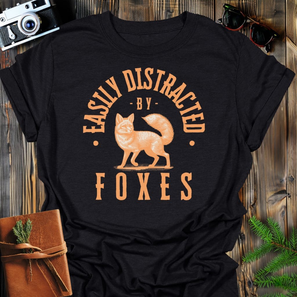 Distracted By Foxes T-Shirt In Black / S Lightweight adventure tee for outdoor lovers Perfect for hiking camping or road trips Made from soft breathable cotton for all-day comfort Ideal for nature lovers and adventurers FAYO Threads outdoor apparel remember Fun Awaits You Outside