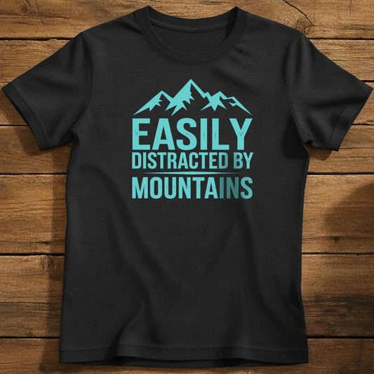 Easily Distracted By Mountains T-Shirt In Black / S Lightweight adventure tee for outdoor lovers Perfect for hiking camping or road trips Made from soft breathable cotton for all-day comfort Ideal for nature lovers and adventurers FAYO Threads outdoor apparel remember Fun Awaits You Outside