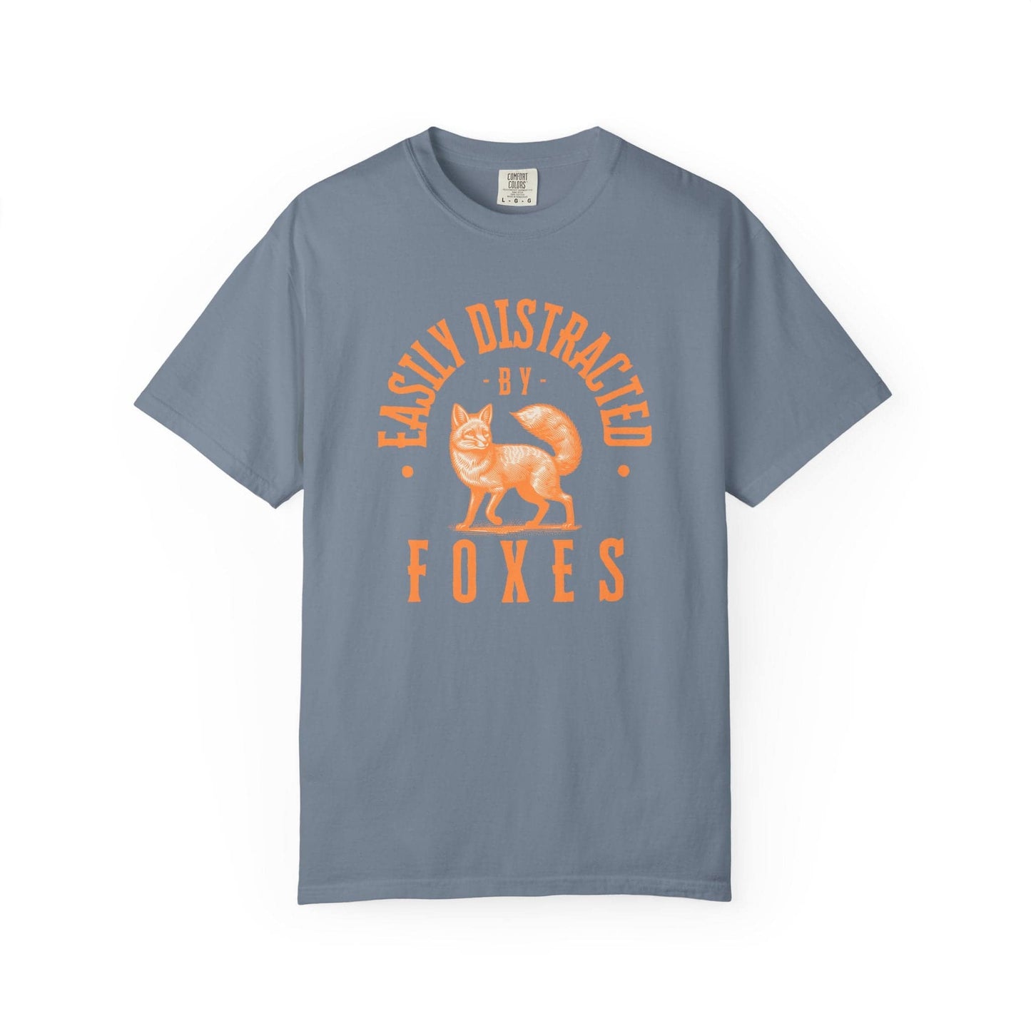 Easily Distracted by Foxes T-Shirt In Blue Jean / S Lightweight adventure tee for outdoor lovers Perfect for hiking camping or road trips Made from soft breathable cotton for all-day comfort Ideal for nature lovers and adventurers FAYO Threads outdoor apparel remember Fun Awaits You Outside