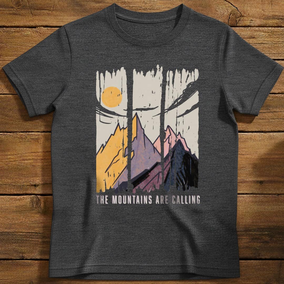 Mountains are Calling T-Shirt In Dark Heather / S Lightweight adventure tee for outdoor lovers Perfect for hiking camping or road trips Made from soft breathable cotton for all-day comfort Ideal for nature lovers and adventurers FAYO Threads outdoor apparel remember Fun Awaits You Outside