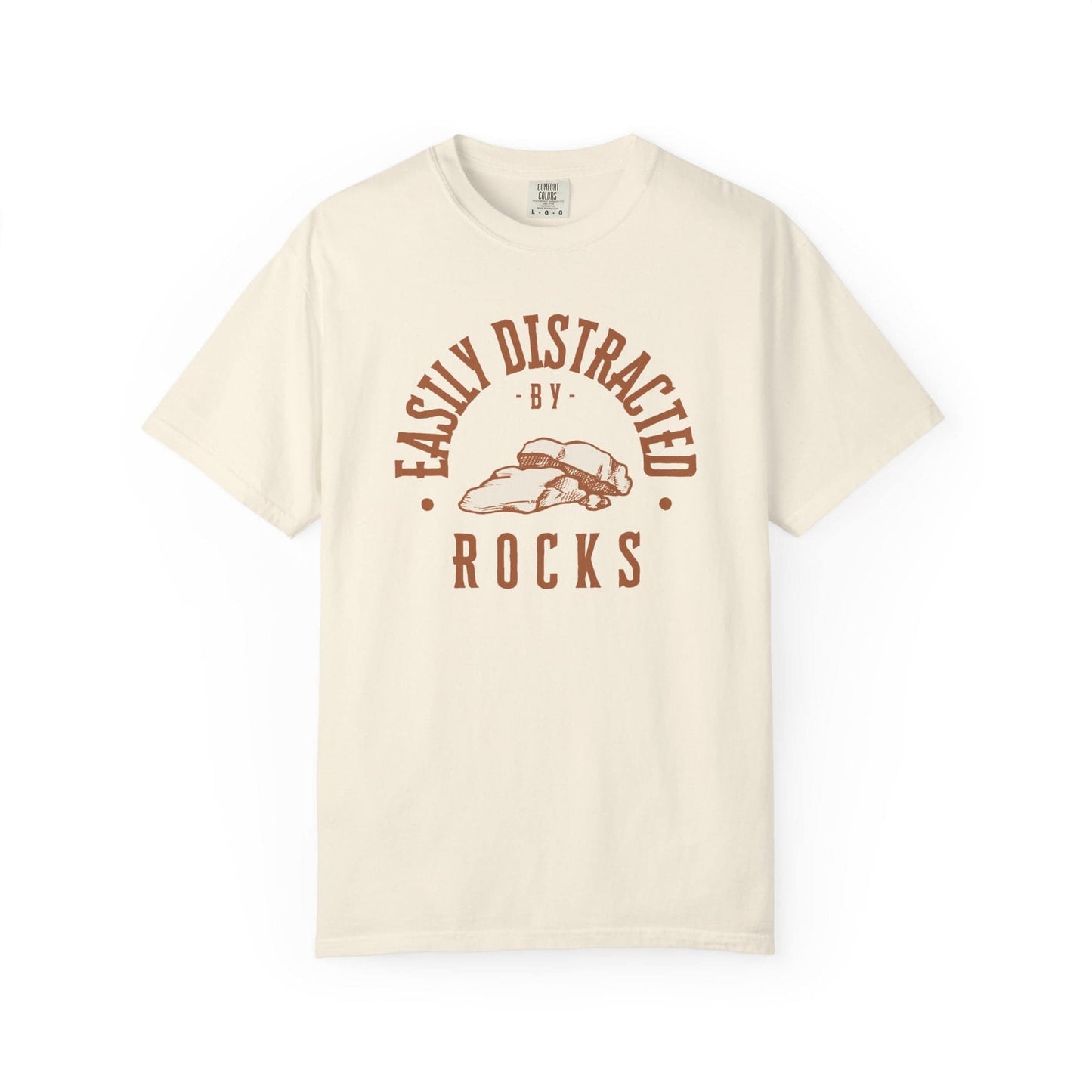 Easily Distracted by Rocks T-Shirt In Ivory / S Lightweight adventure tee for outdoor lovers Perfect for hiking camping or road trips Made from soft breathable cotton for all-day comfort Ideal for nature lovers and adventurers FAYO Threads outdoor apparel remember Fun Awaits You Outside