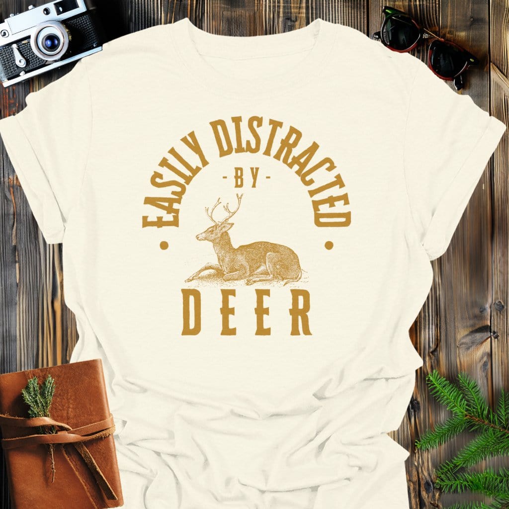 Distracted By Deer T-Shirt In Natural / S Lightweight adventure tee for outdoor lovers Perfect for hiking camping or road trips Made from soft breathable cotton for all-day comfort Ideal for nature lovers and adventurers FAYO Threads outdoor apparel remember Fun Awaits You Outside