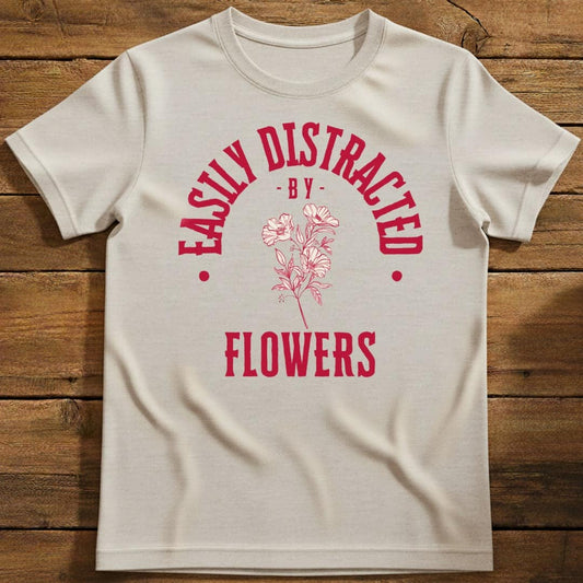 Distracted by Flowers T-Shirt In Natural / S Lightweight adventure tee for outdoor lovers Perfect for hiking camping or road trips Made from soft breathable cotton for all-day comfort Ideal for nature lovers and adventurers FAYO Threads outdoor apparel remember Fun Awaits You Outside