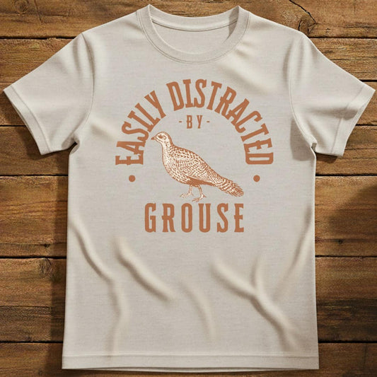Distracted by Grouse T-Shirt In Natural / S Lightweight adventure tee for outdoor lovers Perfect for hiking camping or road trips Made from soft breathable cotton for all-day comfort Ideal for nature lovers and adventurers FAYO Threads outdoor apparel remember Fun Awaits You Outside