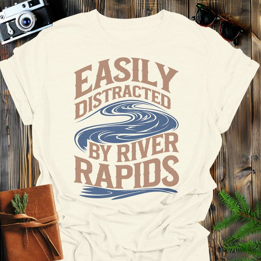 Distracted by Rapids T-Shirt In Natural / S Lightweight adventure tee for outdoor lovers Perfect for hiking camping or road trips Made from soft breathable cotton for all-day comfort Ideal for nature lovers and adventurers FAYO Threads outdoor apparel remember Fun Awaits You Outside