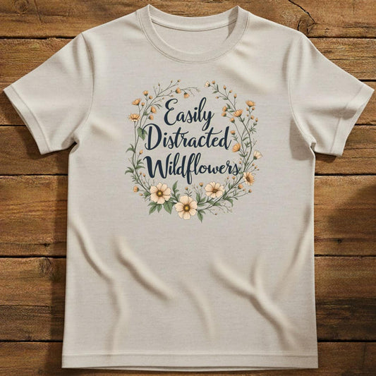 Wildflower Distraction T-Shirt In Natural / S Lightweight adventure tee for outdoor lovers Perfect for hiking camping or road trips Made from soft breathable cotton for all-day comfort Ideal for nature lovers and adventurers FAYO Threads outdoor apparel remember Fun Awaits You Outside
