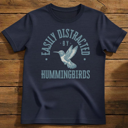 Distracted By Hummingbirds T-Shirt In Navy / S Lightweight adventure tee for outdoor lovers Perfect for hiking camping or road trips Made from soft breathable cotton for all-day comfort Ideal for nature lovers and adventurers FAYO Threads outdoor apparel remember Fun Awaits You Outside