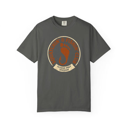 Squatchin' & Fishin' Club T-Shirt In Pepper / S Lightweight adventure tee for outdoor lovers Perfect for hiking camping or road trips Made from soft breathable cotton for all-day comfort Ideal for nature lovers and adventurers FAYO Threads outdoor apparel remember Fun Awaits You Outside