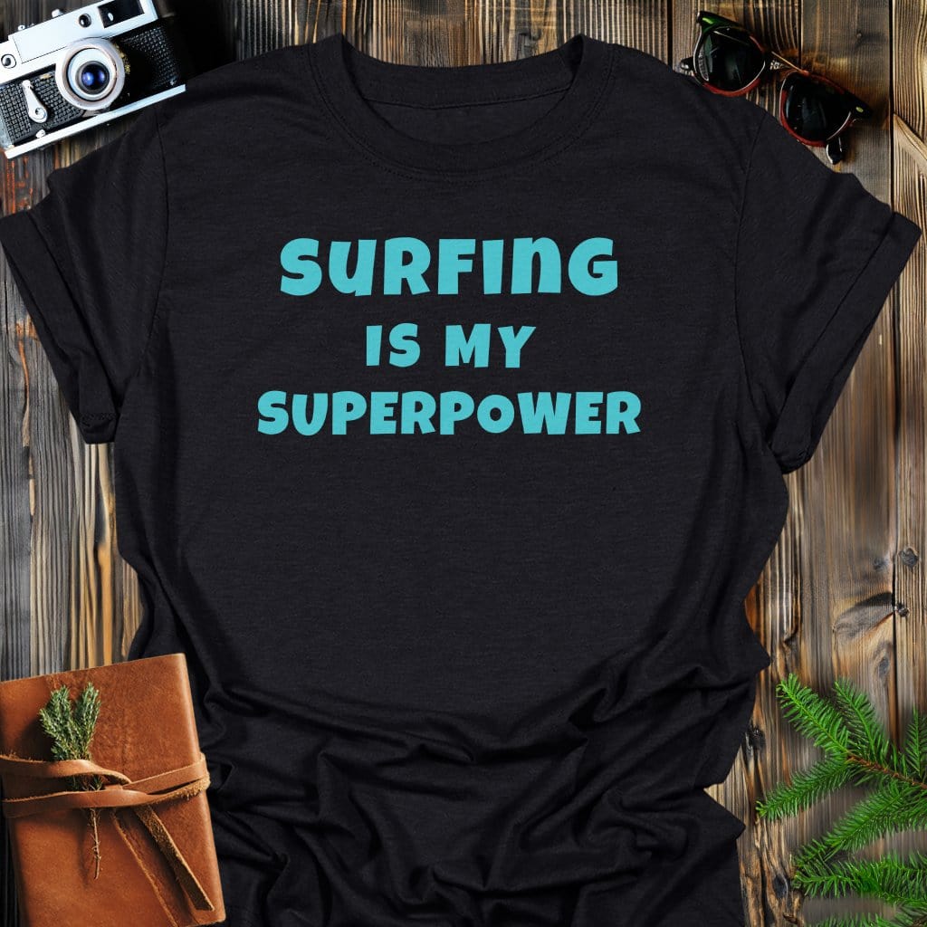 Surfing Superpower T-Shirt In Black / S Lightweight adventure tee for outdoor lovers Perfect for hiking camping or road trips Made from soft breathable cotton for all-day comfort Ideal for nature lovers and adventurers FAYO Threads outdoor apparel remember Fun Awaits You Outside
