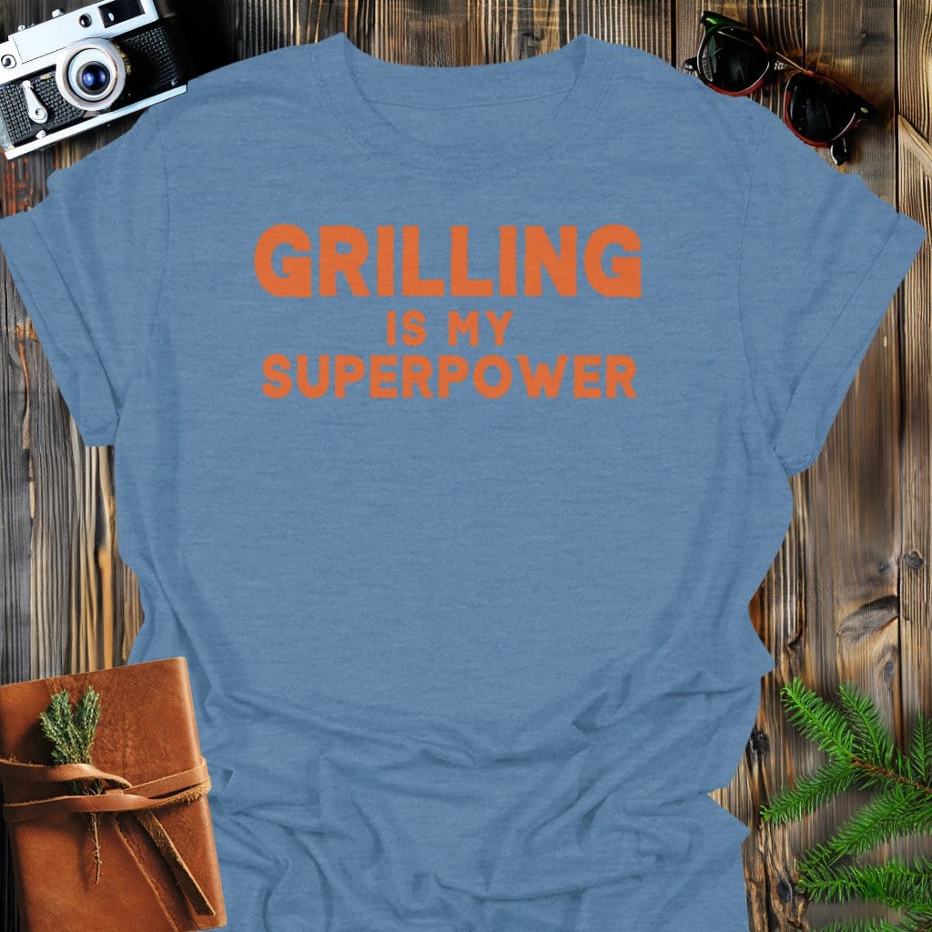 Grilling Superpower T-Shirt In Heather Indigo / S Lightweight adventure tee for outdoor lovers Perfect for hiking camping or road trips Made from soft breathable cotton for all-day comfort Ideal for nature lovers and adventurers FAYO Threads outdoor apparel remember Fun Awaits You Outside