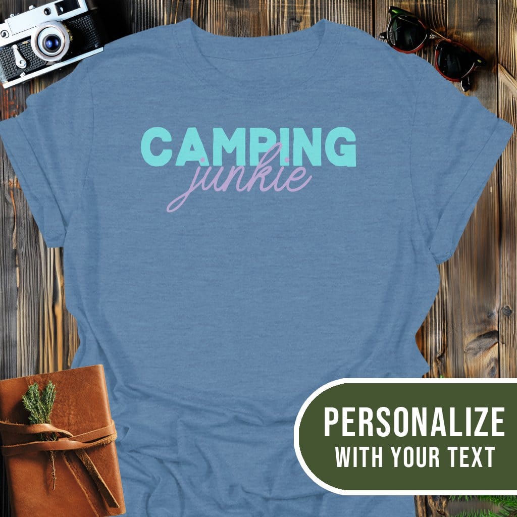 Personalized Camping Junkie T-Shirt In Heather Indigo / S Lightweight adventure tee for outdoor lovers Perfect for hiking camping or road trips Made from soft breathable cotton for all-day comfort Ideal for nature lovers and adventurers FAYO Threads outdoor apparel remember Fun Awaits You Outside
