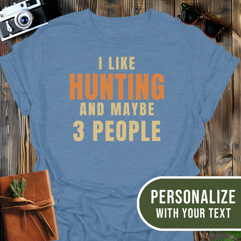 Personalized Hunting Humor T-Shirt In Heather Indigo / S Lightweight adventure tee for outdoor lovers Perfect for hiking camping or road trips Made from soft breathable cotton for all-day comfort Ideal for nature lovers and adventurers FAYO Threads outdoor apparel remember Fun Awaits You Outside