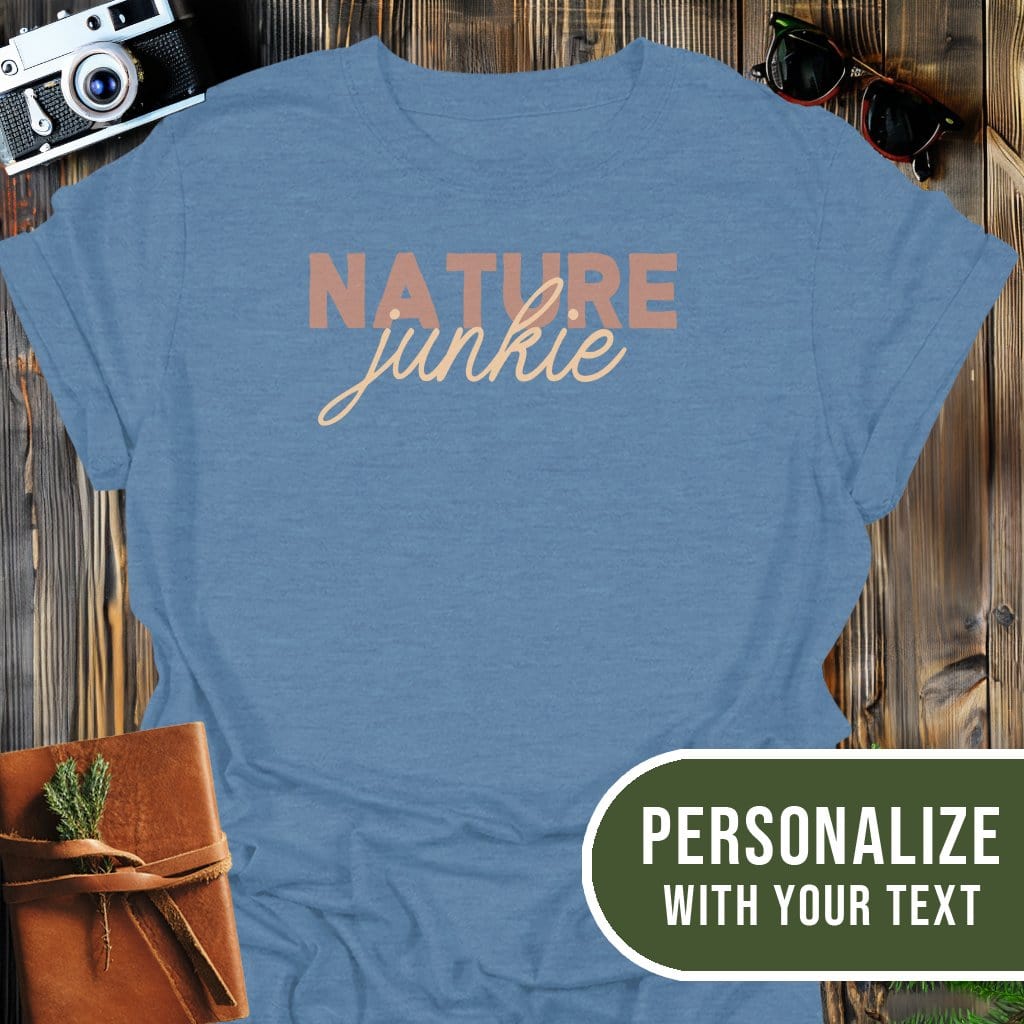 Personalized Nature Junkie T-Shirt In Heather Indigo / S Lightweight adventure tee for outdoor lovers Perfect for hiking camping or road trips Made from soft breathable cotton for all-day comfort Ideal for nature lovers and adventurers FAYO Threads outdoor apparel remember Fun Awaits You Outside