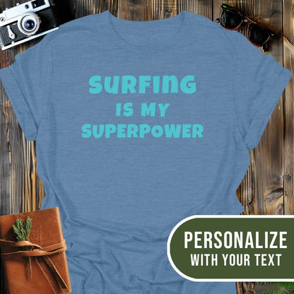 Personalized Surfing Superpower T-Shirt In Heather Indigo / S Lightweight adventure tee for outdoor lovers Perfect for hiking camping or road trips Made from soft breathable cotton for all-day comfort Ideal for nature lovers and adventurers FAYO Threads outdoor apparel remember Fun Awaits You Outside