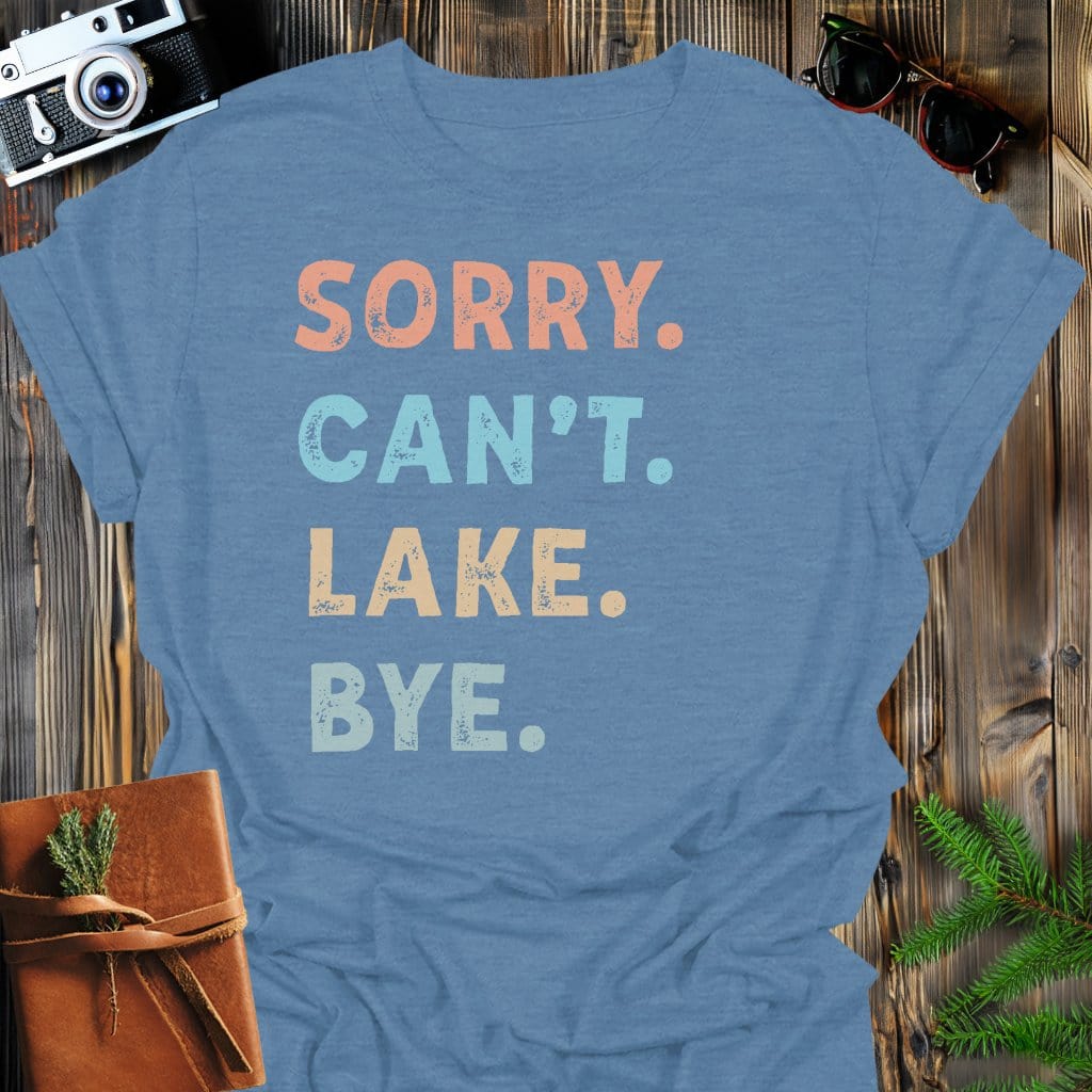 Sorry Can't Lake Bye T-Shirt In Heather Indigo / S Lightweight adventure tee for outdoor lovers Perfect for hiking camping or road trips Made from soft breathable cotton for all-day comfort Ideal for nature lovers and adventurers FAYO Threads outdoor apparel remember Fun Awaits You Outside