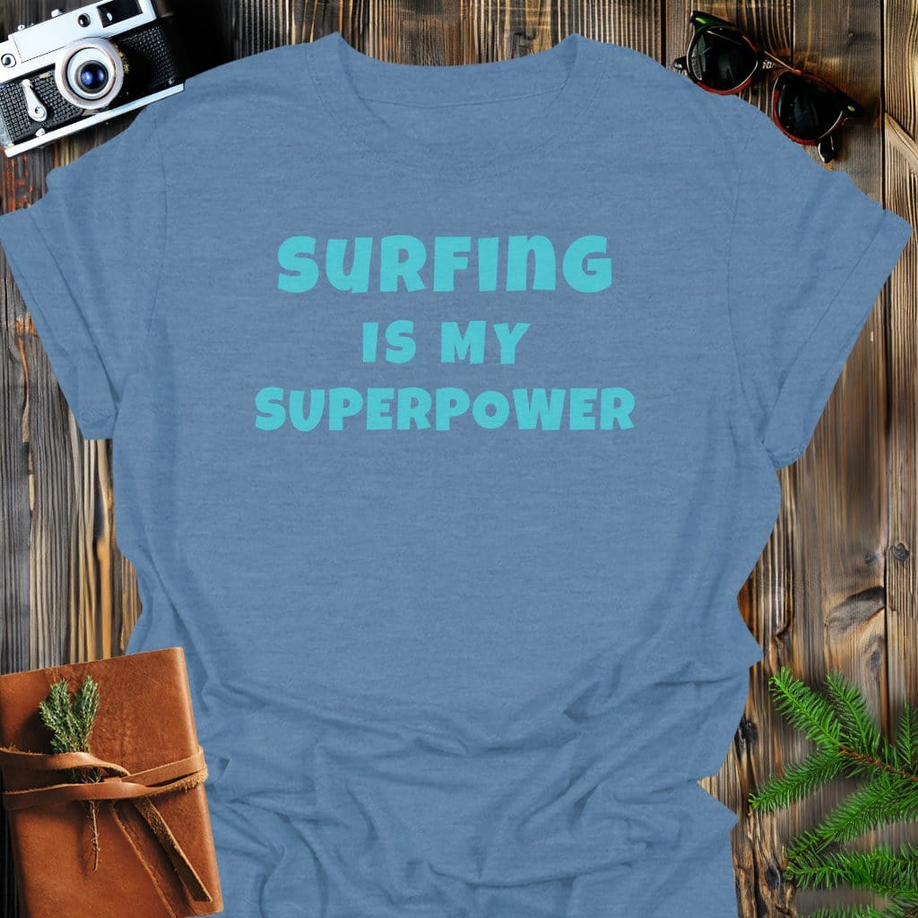 Surfing Superpower T-Shirt In Heather Indigo / S Lightweight adventure tee for outdoor lovers Perfect for hiking camping or road trips Made from soft breathable cotton for all-day comfort Ideal for nature lovers and adventurers FAYO Threads outdoor apparel remember Fun Awaits You Outside