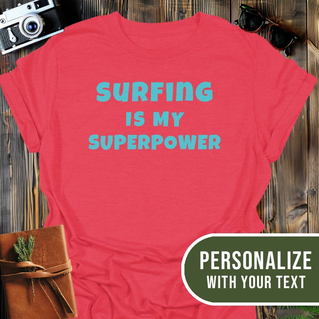 Personalized Surfing Superpower T-Shirt In Heather Red / S Lightweight adventure tee for outdoor lovers Perfect for hiking camping or road trips Made from soft breathable cotton for all-day comfort Ideal for nature lovers and adventurers FAYO Threads outdoor apparel remember Fun Awaits You Outside