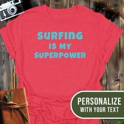 Personalized Surfing Superpower T-Shirt In Heather Red / S Lightweight adventure tee for outdoor lovers Perfect for hiking camping or road trips Made from soft breathable cotton for all-day comfort Ideal for nature lovers and adventurers FAYO Threads outdoor apparel remember Fun Awaits You Outside