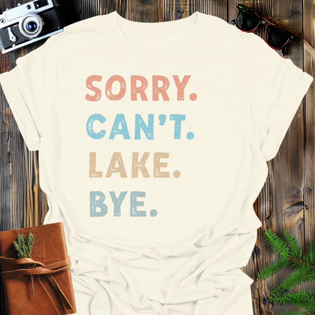 Sorry Can't Lake Bye T-Shirt In Natural / S Lightweight adventure tee for outdoor lovers Perfect for hiking camping or road trips Made from soft breathable cotton for all-day comfort Ideal for nature lovers and adventurers FAYO Threads outdoor apparel remember Fun Awaits You Outside