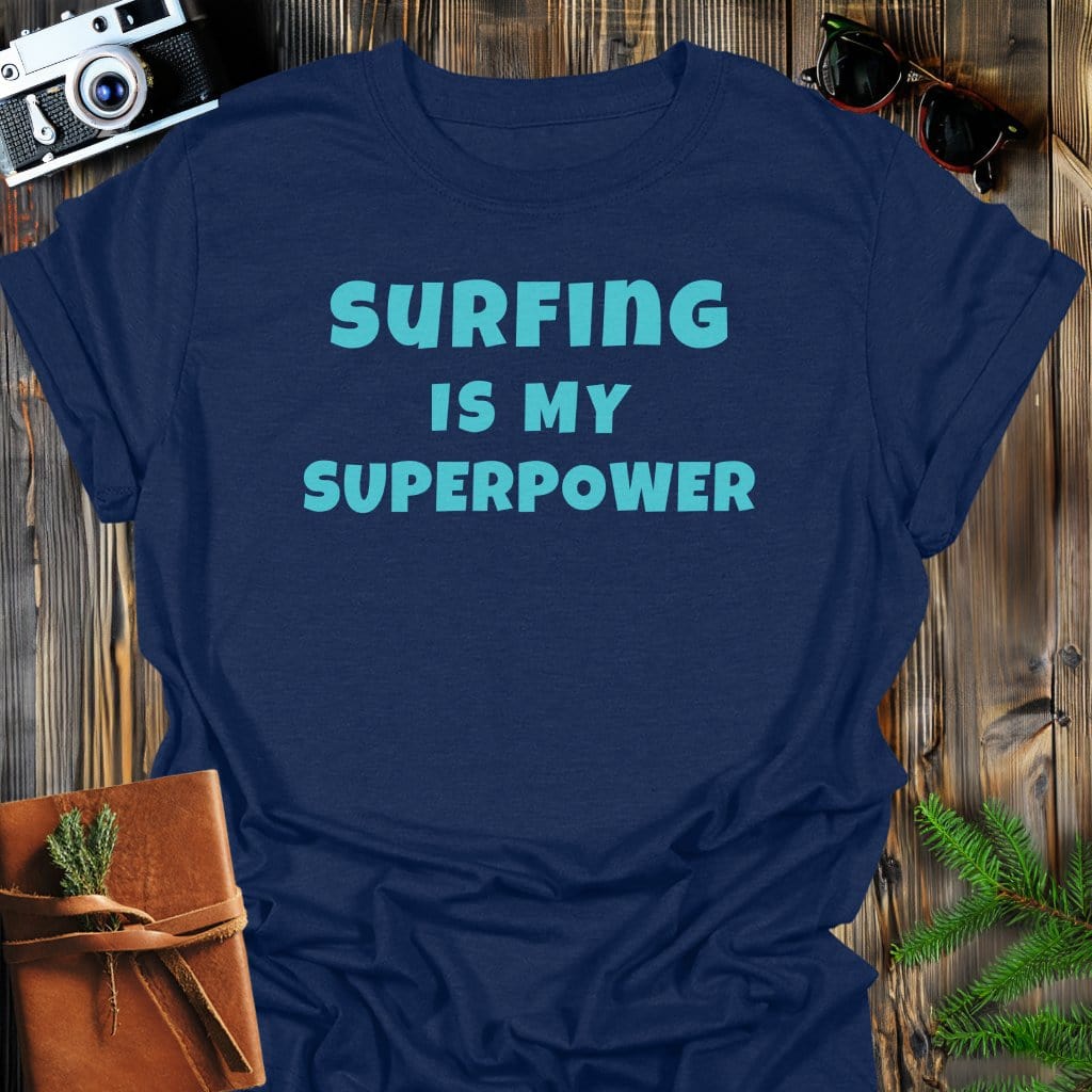 Surfing Superpower T-Shirt In Navy / S Lightweight adventure tee for outdoor lovers Perfect for hiking camping or road trips Made from soft breathable cotton for all-day comfort Ideal for nature lovers and adventurers FAYO Threads outdoor apparel remember Fun Awaits You Outside