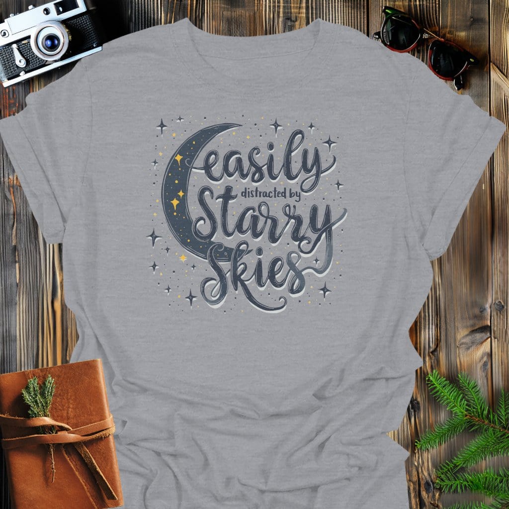 Distracted by Starry Nights T-Shirt In Sport Grey / S Lightweight adventure tee for outdoor lovers Perfect for hiking camping or road trips Made from soft breathable cotton for all-day comfort Ideal for nature lovers and adventurers FAYO Threads outdoor apparel remember Fun Awaits You Outside